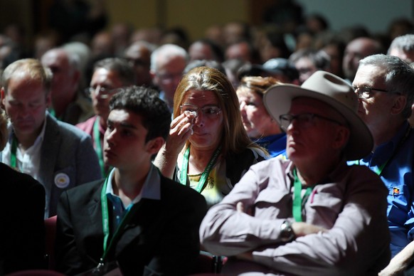 epa07110427 People watch Australian Prime Minister Scott Morrison delivering the National Apology to victims and survivors of Institutional Child Sexual Abuse at Parliament House in Canberra, Australi ...