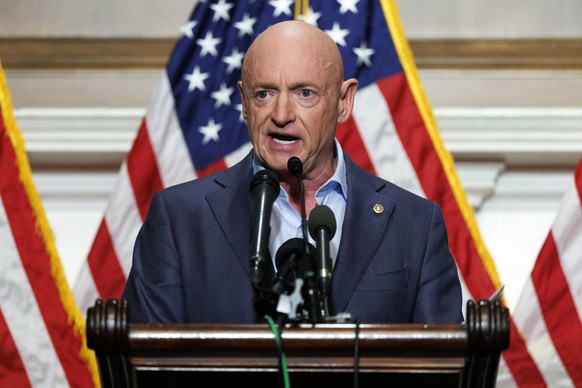epa12563396 Democratic US Senator from Arizona, Mark Kelly addresses a press conference at the US Capitol, Washington, DC, USA, 01 December 2025. Senator Kelly criticized comments by US President Dona ...