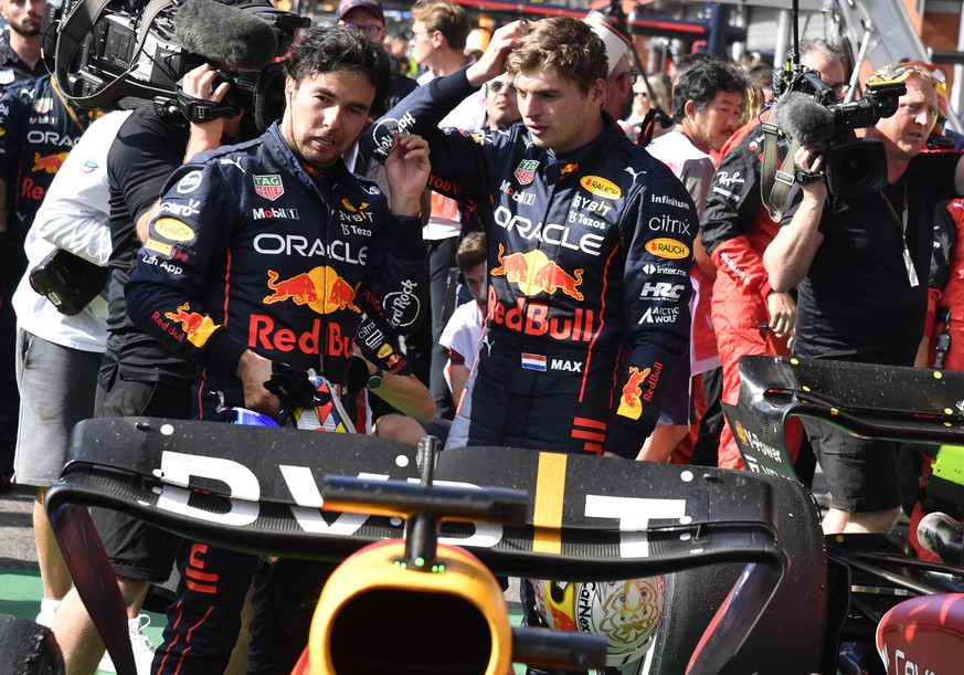 First place, Red Bull driver Max Verstappen of the Netherlands, right, speaks with second place Red Bull driver Sergio Perez of Mexico sin the Parc Ferme after the Formula One Grand Prix at the Spa-Fr ...