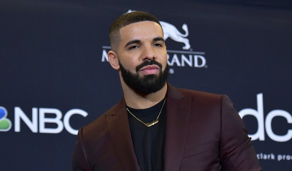 FILE - This May 1, 2019 file photo shows Drake at the Billboard Music Awards in Las Vegas. Earning his 21st No. 1 hit on Billboard&#039;s R&amp;B/Hip-Hop songs chart, Drake has bested a record previou ...