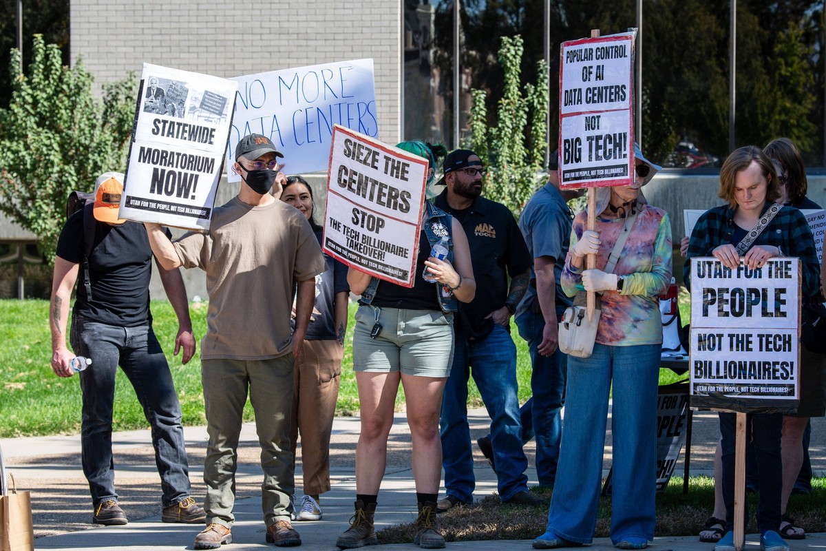 October 7, 2026, Provo, Utah, USA: Demonstrators hold signs opposing a proposed data center zoning ordinance during a community rally outside the Utah County Administration Building. Provo USA PUBLICA ...