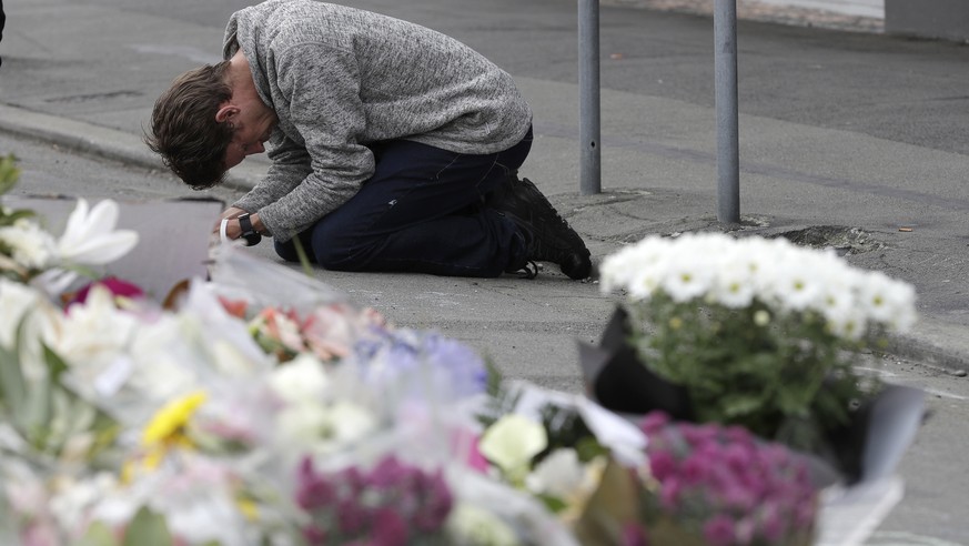 FILE - In this Tuesday, March 19, 2019, file photo, a mourner prays near the Linwood mosque in Christchurch, New Zealand. New Zealand Prime Minister Jacinda Ardern was hailed around the world for her  ...