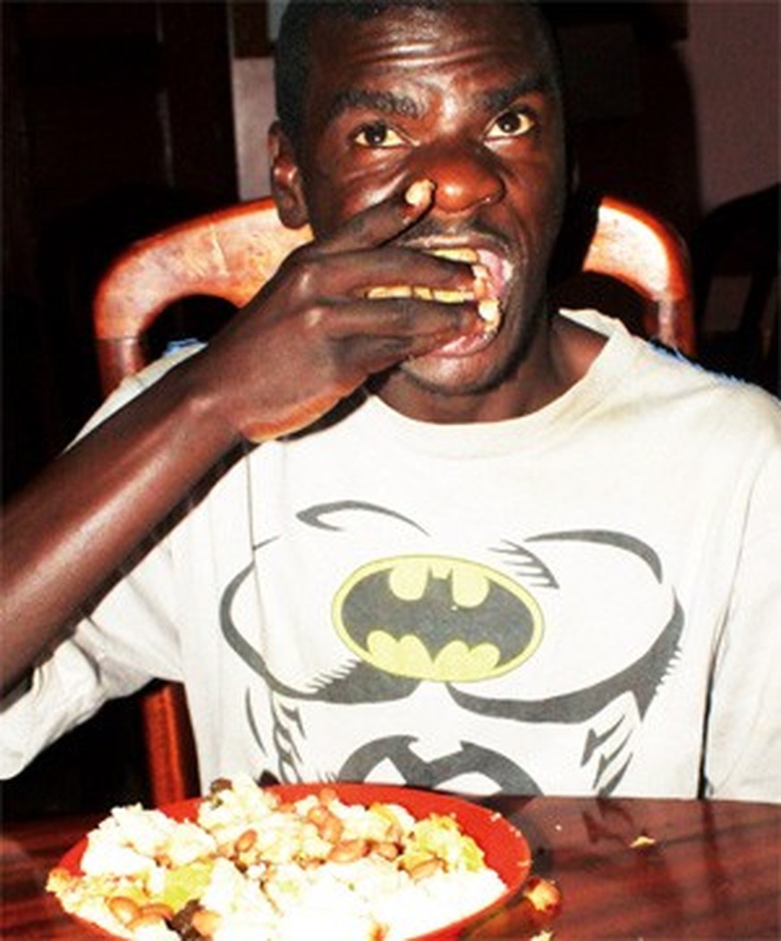 Robert Mayanja
https://crossriverwatch.com/2013/02/ugandan-boy-raised-by-monkeys-tries-to-adapt-photos/