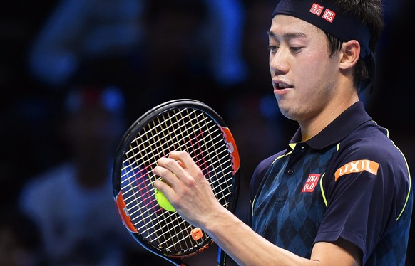 epa05029950 Japan's Kei Nishikori during his round robin match against Tomas Berdych of the Czech Republic at the ATP World Tour Finals tennis tournament in London, Britain, 17 November 2015. EPA ...