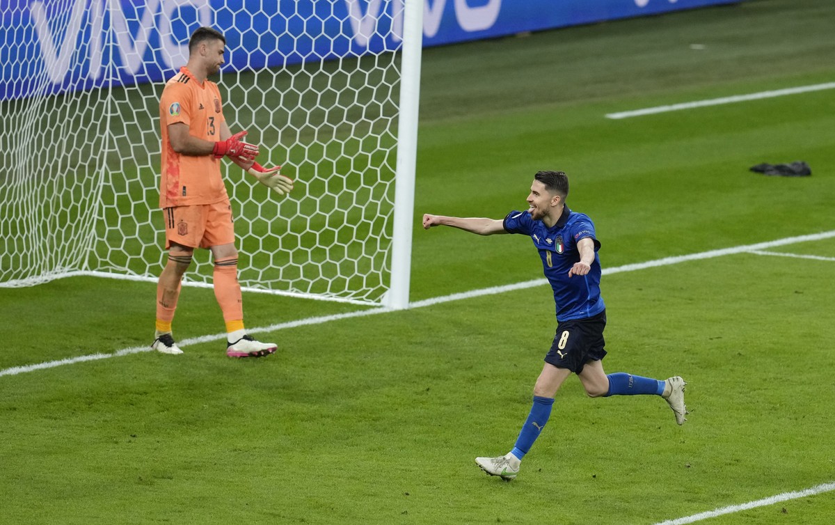 Italy's Jorginho celebrates after scoring the match winning penalty during the Euro 2020 soccer championship semifinal between Italy and Spain at Wembley stadium in London, Tuesday, July 6, 2021. ...