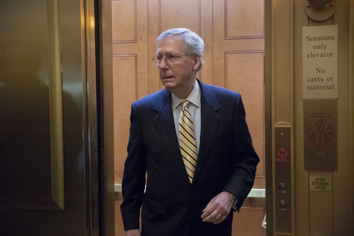 Senate Majority Leader Mitch McConnell, R-Ky, heads to a meeting with Treasury Secretary Steven Mnuchin, Trump's top economic adviser Gary Cohn, and members of the Senate Budget Committee as they ...