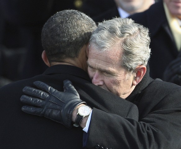 Former President George W. Bush, right, hugs President Barack Obama after Obama was sworn in at the U.S. Capitol in Washington, Tuesday, Jan. 20, 2009. (AP Photo/Ron Edmonds)