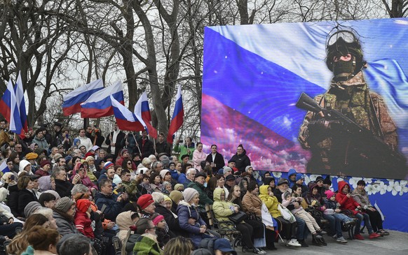 epa10530697 People attend an event on the ninth anniversary of Russia&#039;s annexation of Crimea in Sevastopol, Crimea, 18 March 2023. Russia in 2014 annexed the Black Sea peninsula, shortly after Cr ...
