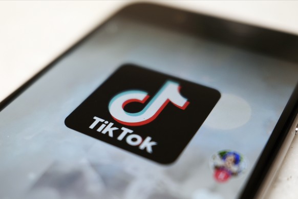 FILE - The TikTok logo is displayed on a smartphone screen in Tokyo on Sept. 28, 2020. TikTok says it&#039;s going to start automatically labeling content that&#039;s made by artificial intelligence w ...