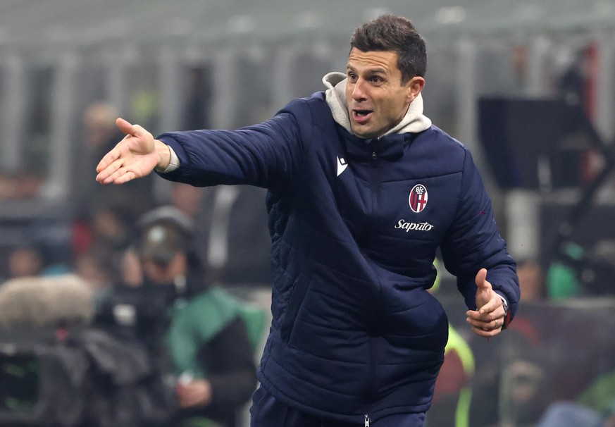 epa11109206 Bologna���s head coach Thiago Motta reacts during the Italian Serie A soccer match between AC Milan and Bologna at Giuseppe Meazza stadium in Milan, Italy, 27 Jenuary 2024. EPA/MATTEO BAZZ ...