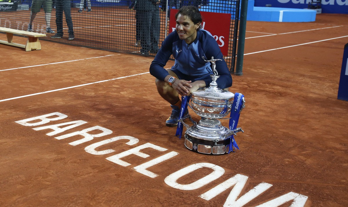 Spain's Rafael Nadal poses for a photo with the trophy after winning the Barcelona Open tennis tournament in Barcelona, Spain, Sunday, April 24, 2016. Spain's Rafael Nadal defeated Japans K ...