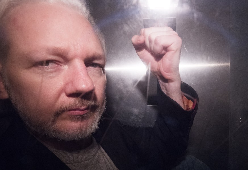 epa07595591 (FILE) - Wikileaks co-founder Julian Assange, in a prison van, as he leaves Southwark Crown Court in London, Britain, 01 May 2019, reissued 13 May 2019 (reissued 23 May 2019). According to ...
