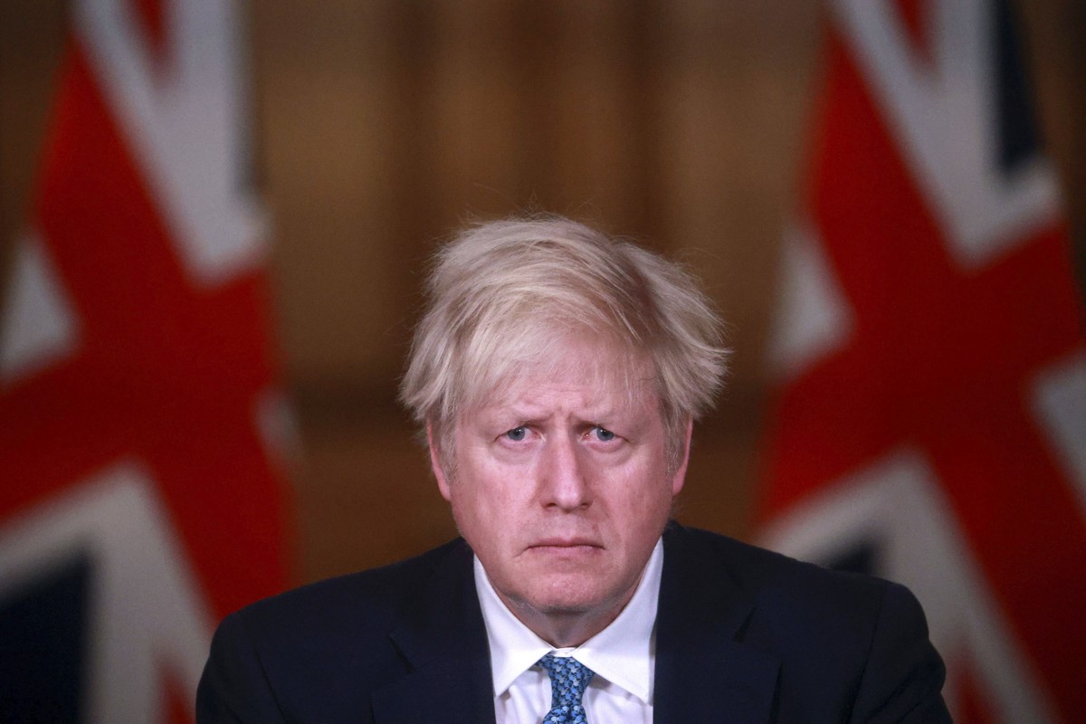 Britain's Prime Minister Boris Johnson speaks during a news conference in response to the ongoing situation with the coronavirus (COVID-19) pandemic, inside 10 Downing Street in London, Tuesday,  ...
