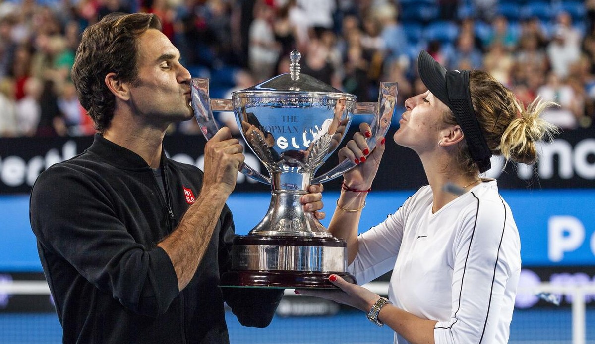 epa07264149 Roger Federer and Belinda Bencic of Switzerland hold up the Hopman Cup after winning the mixed doubles match between Switzerland and Germany on day 8 of the Hopman Cup tennis tournament at ...