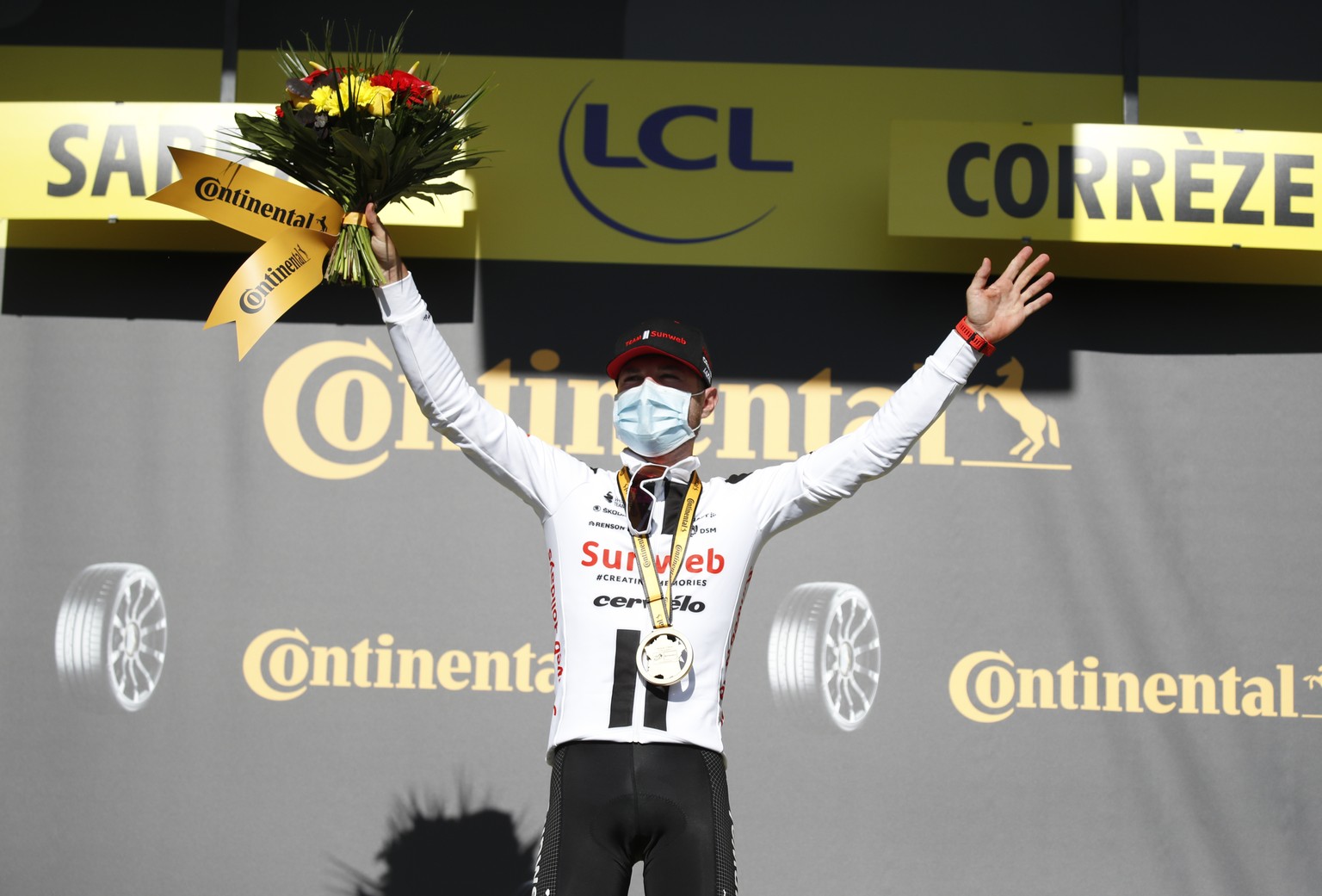 Switzerland&#039;s Marc Hirschi celebrates on the podium after winning the stage 12 of the Tour de France cycling race over 218 kilometers from Chauvigny to Sarran, Thursday, Sept. 10, 2020. (Sebastie ...