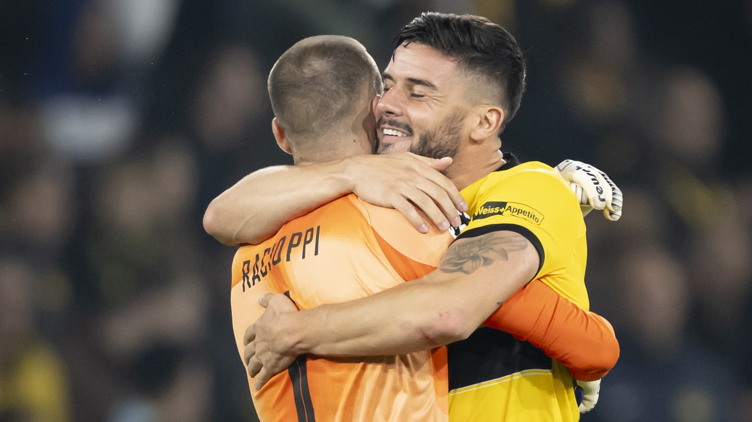 epa10827617 YB&#039;s goalkeeper Anthony Racioppi, left, and YB&#039;s Loris Benito, right, celebrate after winning (3-0) the UEFA Champions League Play-off 2nd leg match between Switzerland&#039;s BS ...