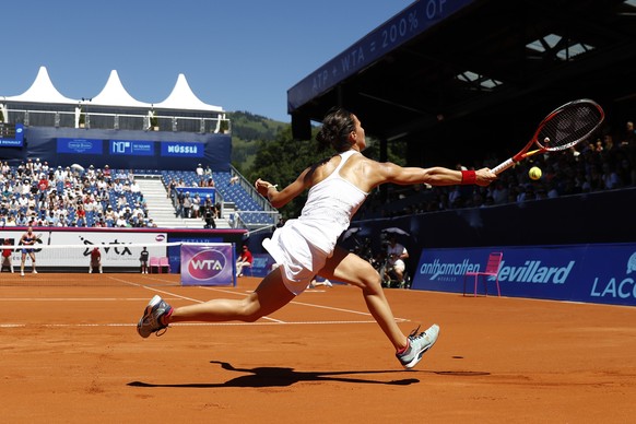 Viktorija Golubic of Switzerland returns a ball during the final match against Kiki Bertens of the Netherlands, at the WTA tennis tournament in Gstaad, Switzerland, Sunday, July 17, 2016. (Peter Klaun ...