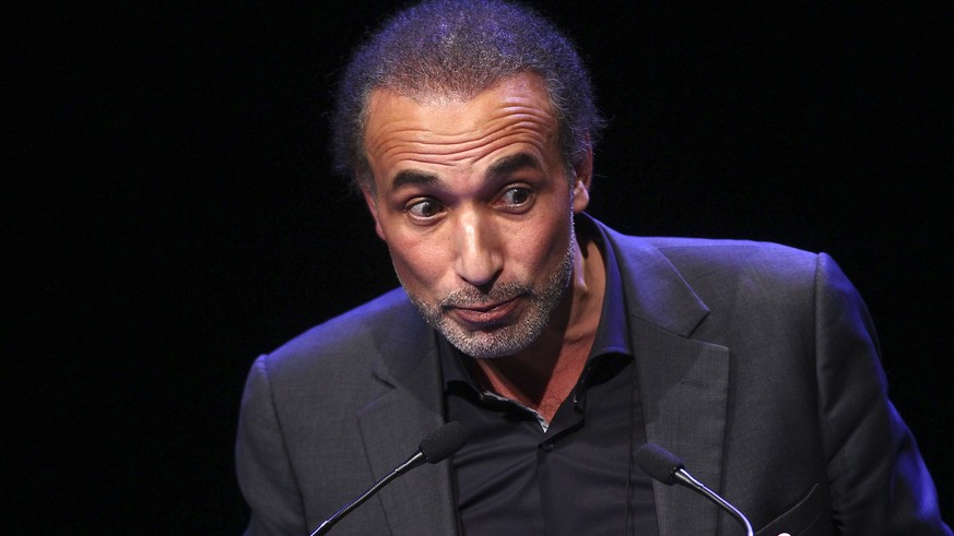 FILE - In this Feb.7 2016 file photo, Muslim scholar Tariq Ramadan delivers a speech during a French Muslim organizations meeting in Lille, northern France. A French judge has decided to keep prominen ...