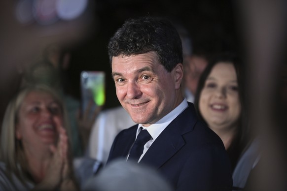 Presidential candidate Nicusor Dan smiles after polls closed in the first round of the country&#039;s presidential election redo in Bucharest, Romania, Sunday, May 4, 2025. (AP Photo/Eduard Vinatoru)
 ...