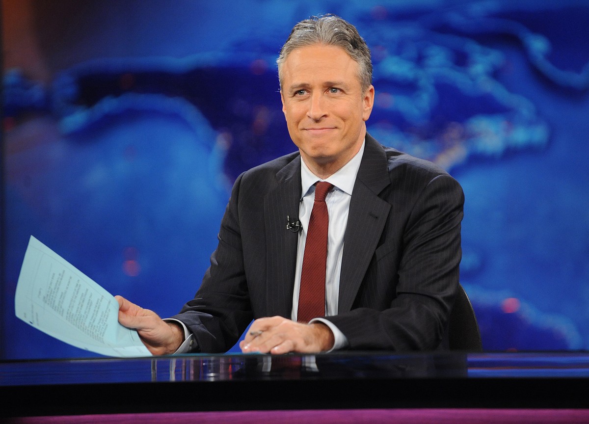 FILE - This Nov. 30, 2011 file photo shows television host Jon Stewart during a taping of "The Daily Show with Jon Stewart" in New York. Stewart says Aug. 6, 2015 will be his last night host ...