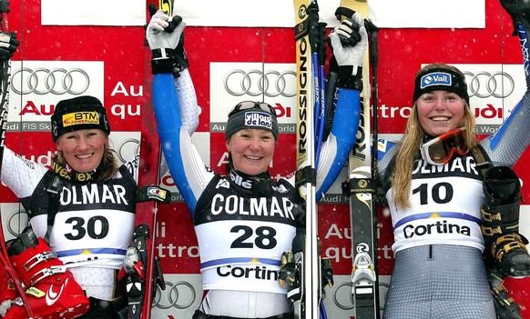 From L-R Austrian Renate Goetschl (2nd), French Carole Montillet (1st) and US Lindsey C. Kildow (3rd) jubilate on the podium after the World Cup women&#039;s downhill race in Cortina d&#039; Ampezzo,  ...