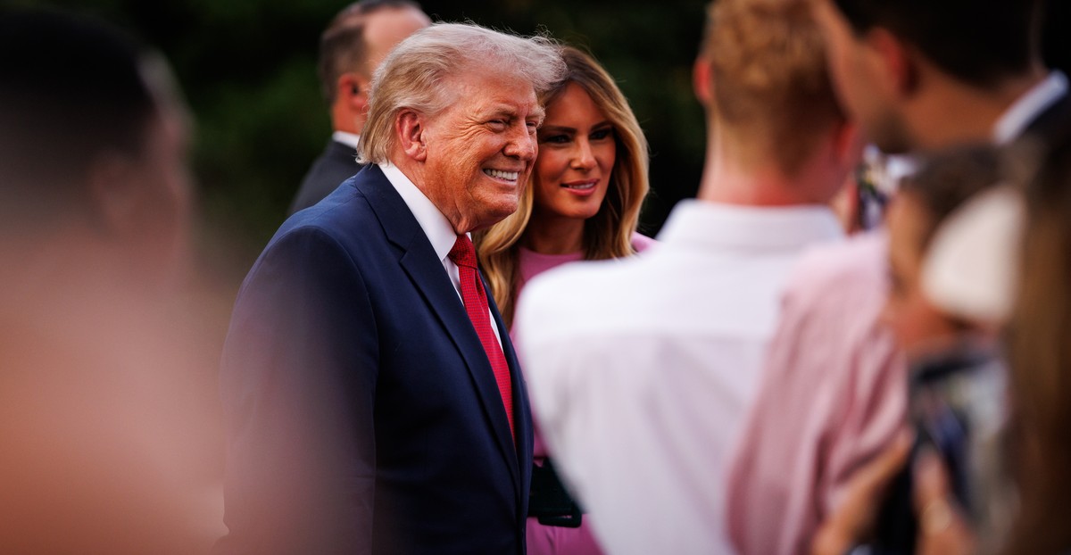epa12975983 US President Donald Trump (C-L) and First Lady Melania Trump greet guests during the Congressional Picnic on the South Lawn of the White House in Washington, DC, USA, 19 May 2026. EPA/SAMU ...