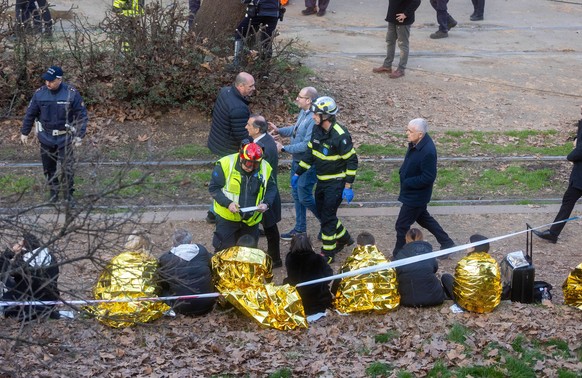Rescuers at work on the scene of a tram derailment in downtown Milan, Italy, Friday, Feb. 27, 2026. (Stefano Porta/LaPresse via AP)
Italy Tram Derailment