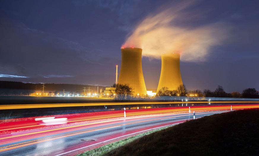 Steam rises from the cooling towers of the Grohnde nuclear power plant near Grohnde, Germany, Wednesday, Dec. 29, 2021. Germany on Friday, Dec. 31, 2021 is shutting down half of the six nuclear plants ...