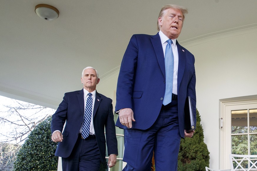 epa08931299 (FILE) - US President Donald J. Trump and Vice President Mike Pence walk out of the Oval Office to the Coronavirus Task Force briefing about the COVID-19 pandemic, in the Rose Garden at th ...