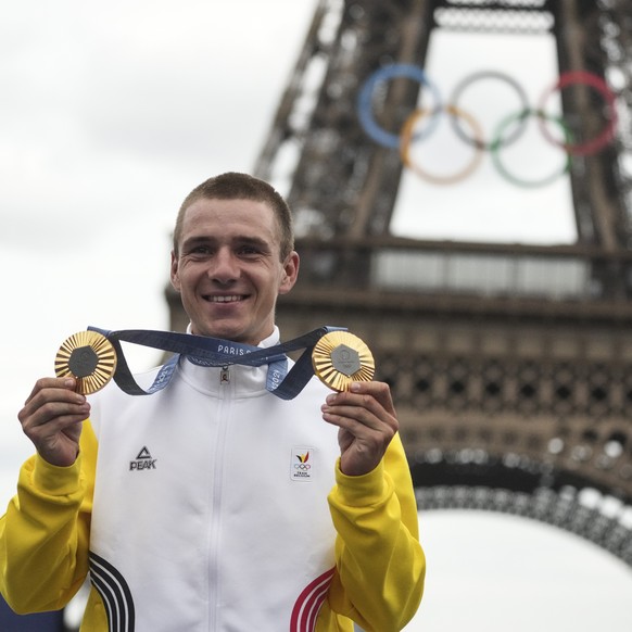 FILE -Remco Evenepoel, of Belgium, shows his gold medals of the men&#039;s time trial and road cycling events, at the 2024 Summer Olympics, Saturday, Aug. 3, 2024, in Paris, France. (AP Photo/Thibault ...