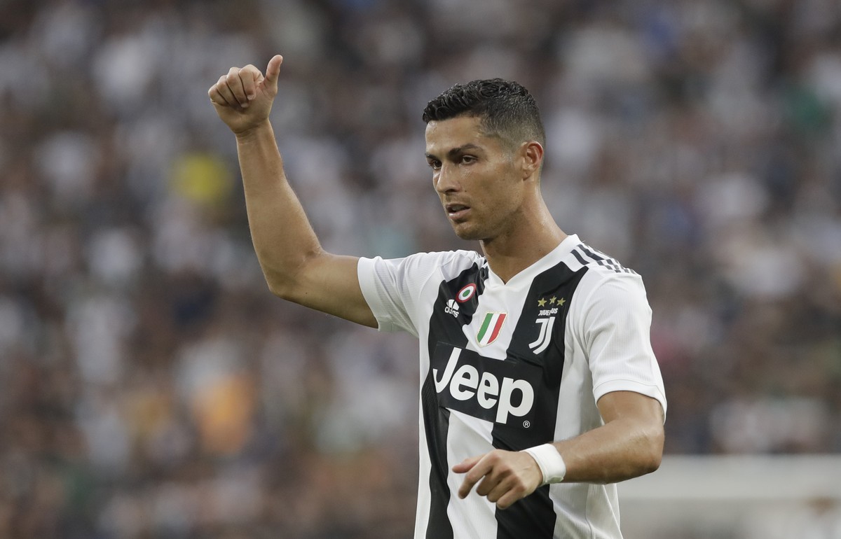 Juventus' Cristiano Ronaldo, gestures to his teammates during the Serie A soccer match between Juventus and Lazio at the Allianz Stadium in Turin, Italy, Saturday, Aug. 25, 2018. (AP Photo/Luca B ...
