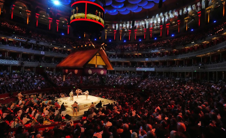 Sumo wrestlers, called rikishi, prepare for their bouth on the dohyo, the sacred sumo wrestling ring, during The Grand Sumo Tournament at the Royal Albert Hall in London, Wednesday, Oct. 15, 2025.(AP  ...