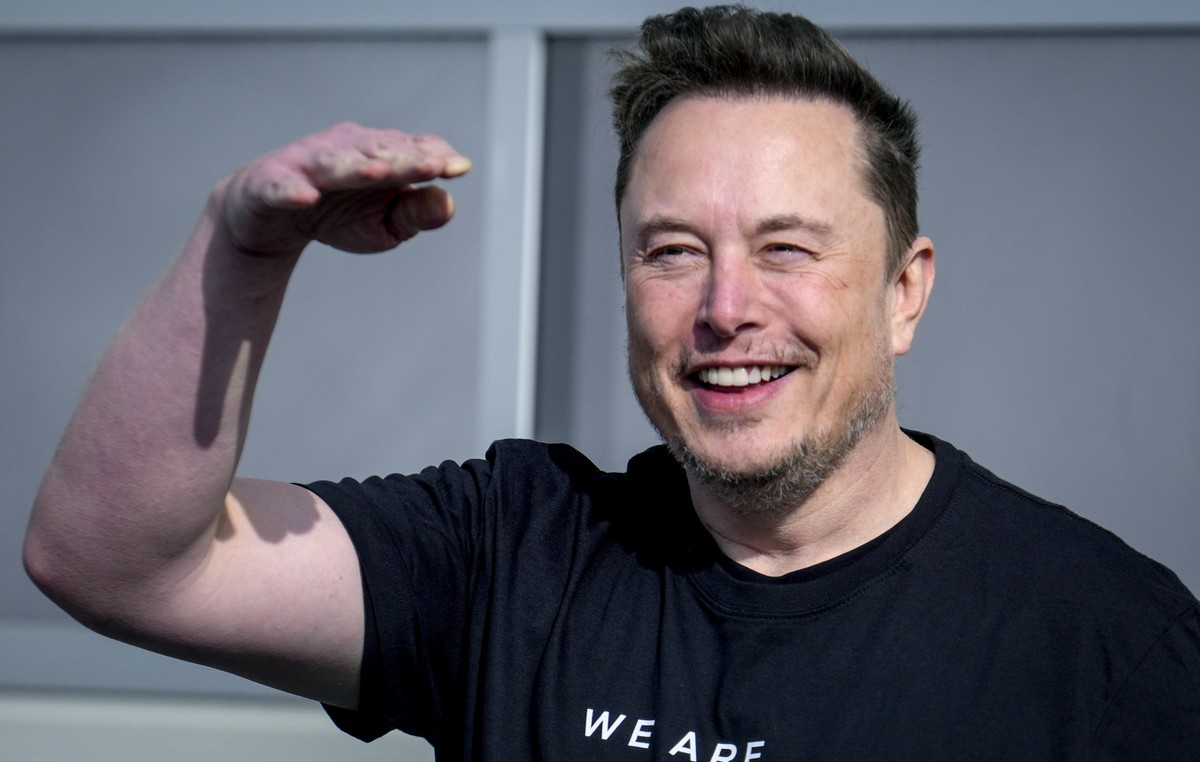 Tesla CEO Elon Musk waves as he leaves the Tesla Gigafactory for electric cars after a visit in Gruenheide near Berlin, Germany, Wednesday, March 13, 2024. Power has been restored to electric car manu ...
