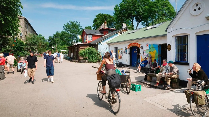 Christiania in 2006: A woman cycles through the Free City.
