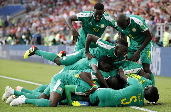 epa06821782 Senegal&#039;s players celebrate the 2-0 lead during the FIFA World Cup 2018 group H preliminary round soccer match between Poland and Senegal in Moscow, Russia, 19 June 2018.

(RESTRICT ...