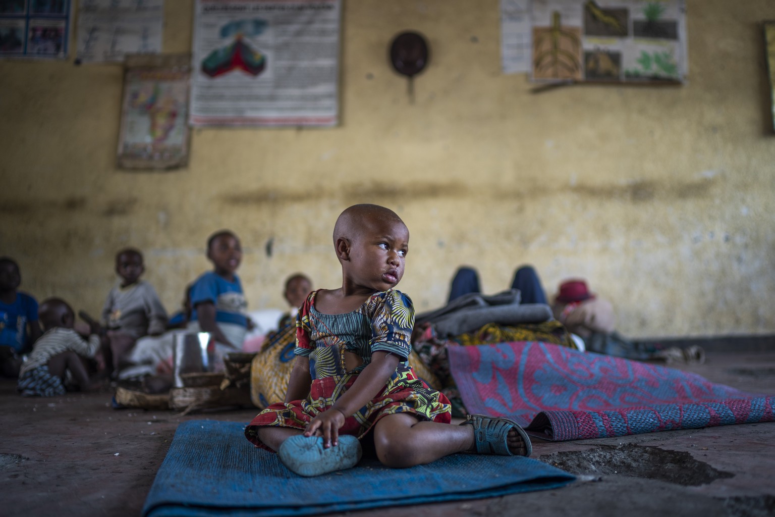 FILE �?? Emma, 3, who was displaced by the fighting between M23 rebels and FARDC government forces, finds refuge in a school North of Goma, Democratic Republic of Congo, Nov. 25, 2022. A new U.N. repo ...