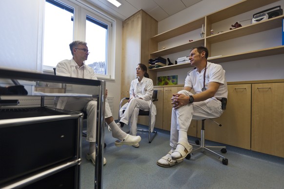 Three doctors of &quot;Ospidale Val Muestair&quot; hospital during the morning meeting in a parlour, pictured on February 17, 2012, in Santa Maria in the canton of Grisons, Switzerland. The hospital & ...