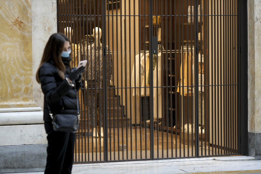 Shops are closed in Galleria Umberto, in downtown Naples, southern Italy, Wednesday, March 11, 2020. In Italy the government extended a coronavirus containment order previously limited to the country& ...