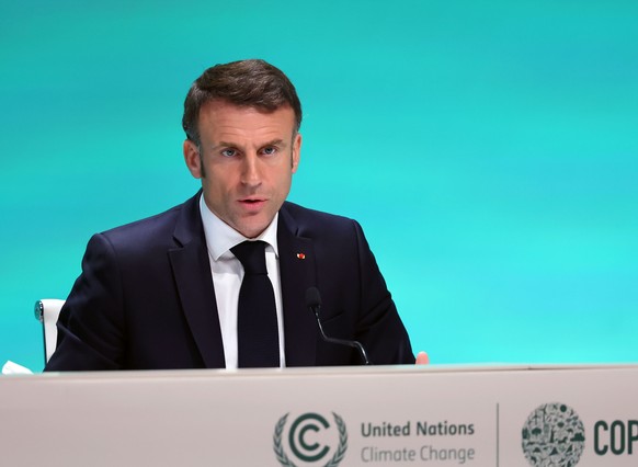 epa11007401 French President Emmanuel Macron speaks during a press conference as part of the third day of the 2023 United Nations Climate Change Conference (COP28) at Expo City Dubai in Dubai, UAE, 02 ...