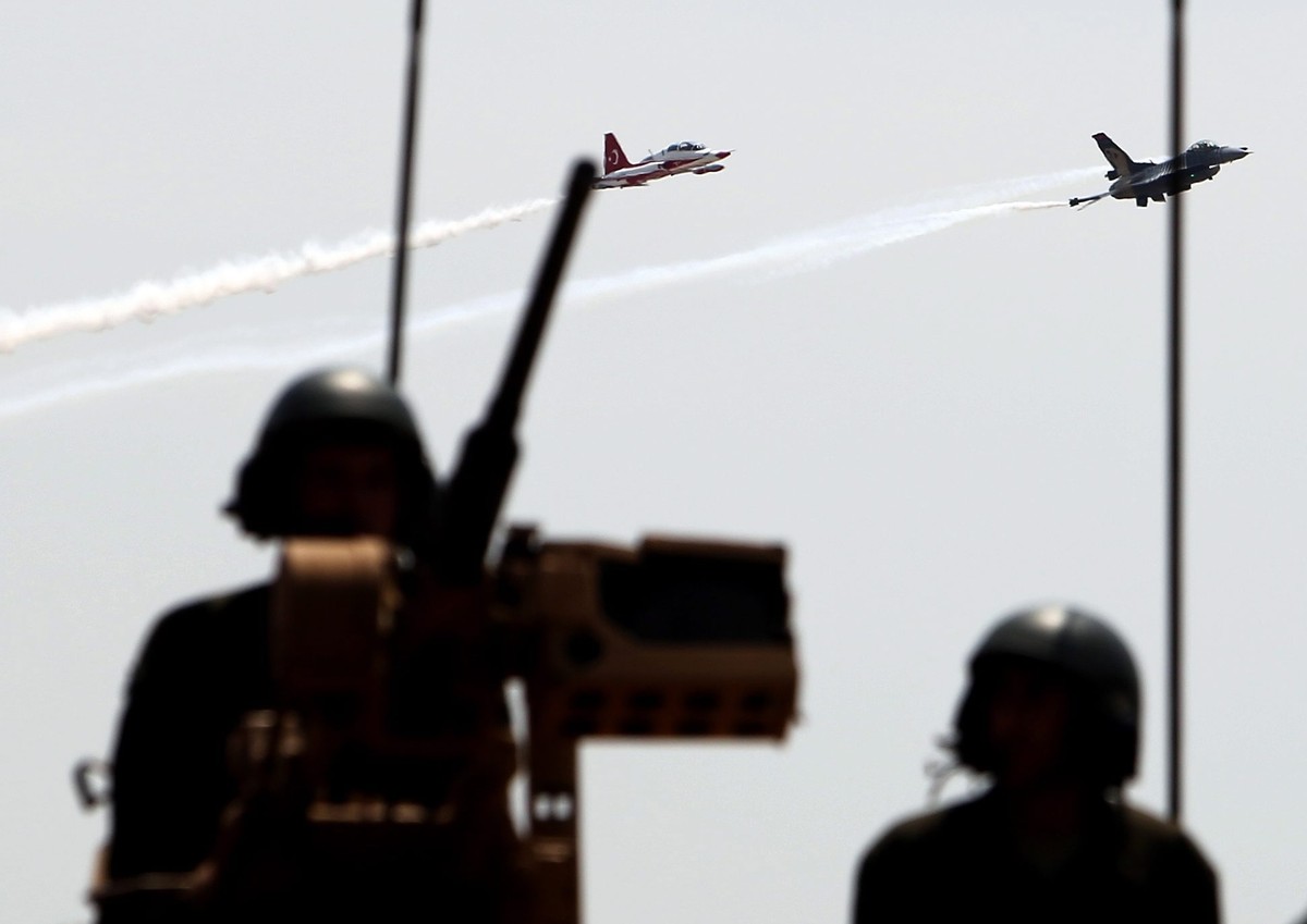 epa04323853 Fighter jets perfom in the sky during a Turkish Cypriot military parade to celebrate the 1974 Turkish invasion of northern Cyprus, in Nicosia, Cyprus, 20 July 2014. The year 2014 marks the ...