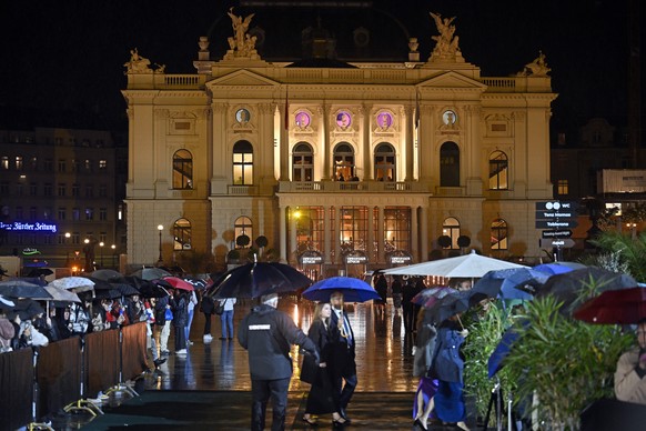 Visitors wait in front of the opera house for the green carpet during the Award Night ceremony of 20th Zurich Film Festival (ZFF) in Zurich, Switzerland, on Saturday, October 12, 2024. The Zurich Film ...