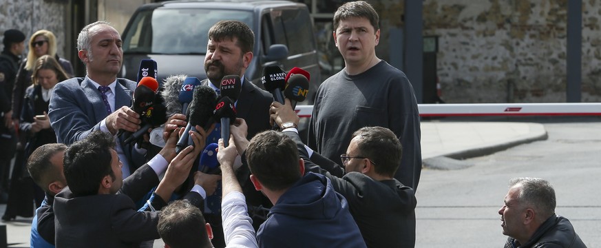 Mykhailo Podolyak, adviser to Ukrainian President Volodymyr Zelenskyy and member of the Ukrainian delegation, center right, speaks to the media after talks between Russian and Ukrainian delegations, i ...