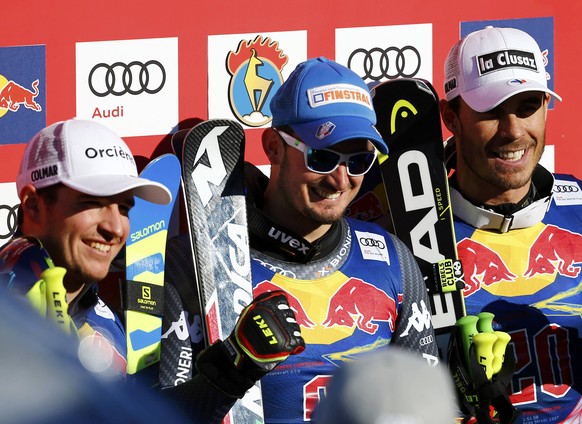 Alpine Skiing - FIS Alpine Skiing World Cup - Men&#039;s Downhill Race - Kitzbuehel, Austria - 21/01/17 - Valentin Giraud Moine of France, Dominik Paris of Italy and Johan Clarey of France at the fini ...