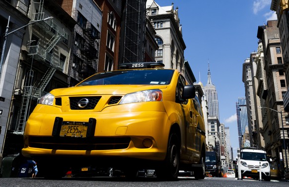 epa06939036 A New York taxi drives down 6th Avenue the day after passage of for-hire vehicle legislation by the New York City Council in New York, New York, USA, 09 August 2018. The council passed leg ...