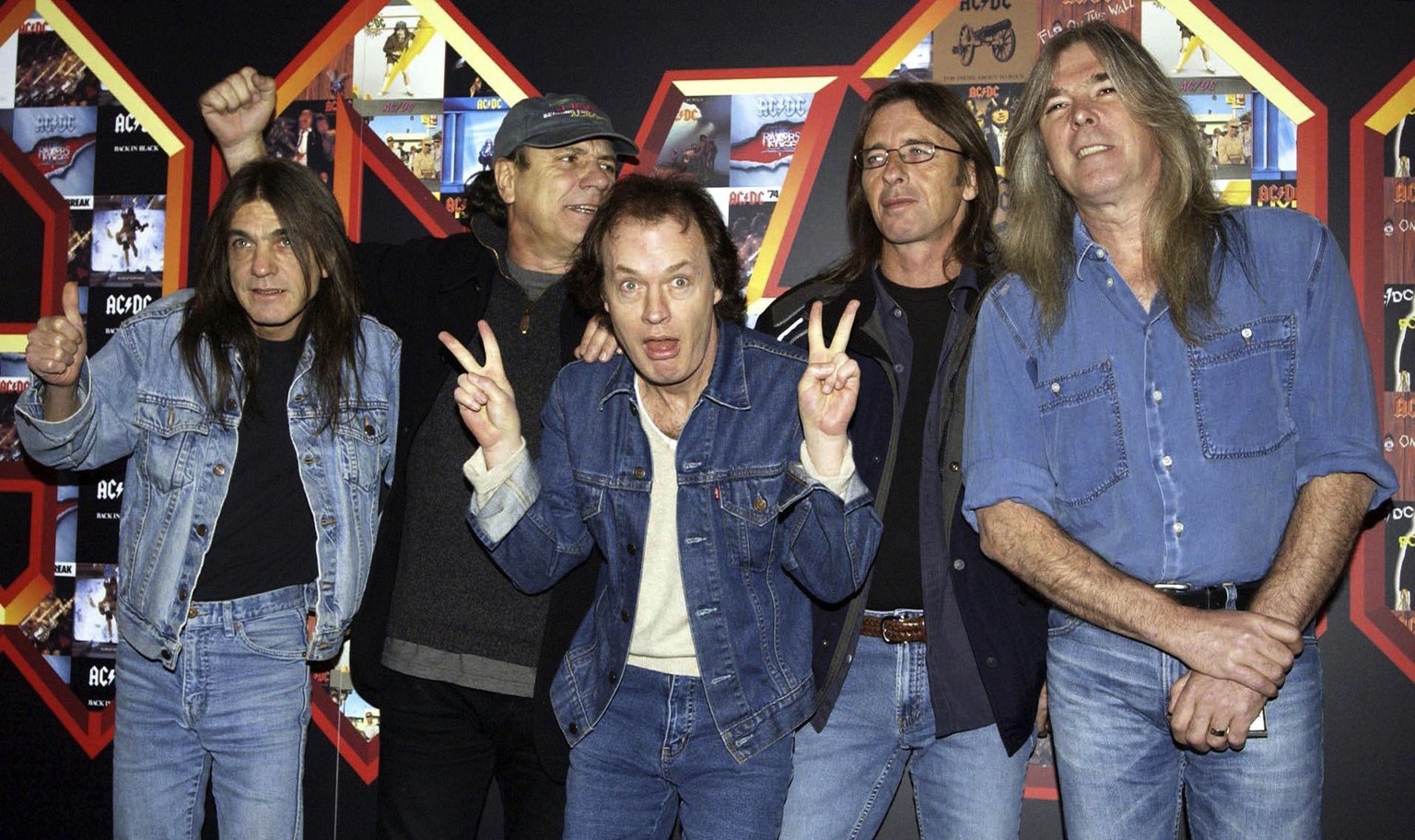 FILE - A March 3, 2003 file photo of from left: Malcolm Young, Brian Johnson, Angus Young, Phil Rudd and Cliff Williams from AC/DC posing for photographers at the Apollo Hammersmith in London. The ban ...