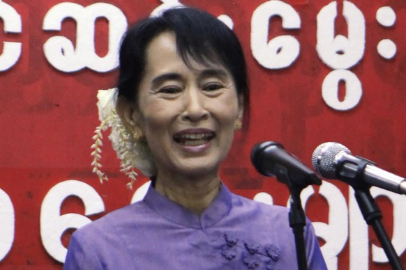 FILE - Myanmar democracy icon Aung San Suu Kyi speaks during cerebrations for the 96th birthday anniversary of her late father, General Aung San, and Myanmar Children Day at her National League for De ...