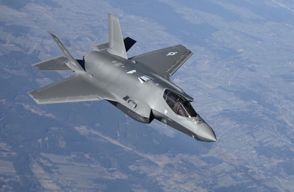 In this image provided by the U.S. Air Force, a U.S. Air Force F-35 Lightning II aircraft assigned to the 34th Fighter Squadron, departs from a KC-10 Extender aircraft after receiving fuel over Poland ...