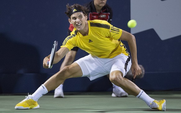 Dominic Thiem of Austria returns to Diego Schwartzman of Argentina during the first round of the Rogers Cup tennis tournament, Tuesday Aug. 8, 2017 in Montreal. (Graham Hughes/The Canadian Press via A ...