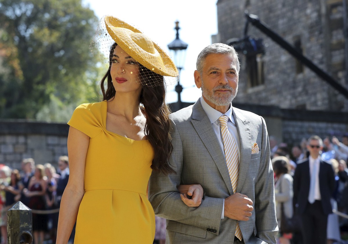 Amal Clooney and George Clooney arrive for the wedding ceremony of Prince Harry and Meghan Markle at St. George's Chapel in Windsor Castle in Windsor, near London, England, Saturday, May 19, 2018 ...