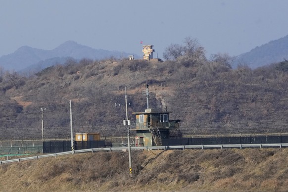 Military guard posts of North Korea, rear, and South Korea, front, are seen in Paju, near the border with North Korea, South Korea, Sunday, Jan. 2, 2022. South Korea&#039;s military said Sunday that a ...